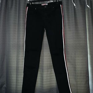 Black pants with red and white stripe on the side